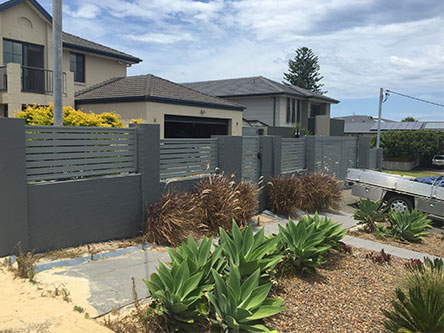 House with grey slatting fence - Fencing Contractors Newcastle, NSW